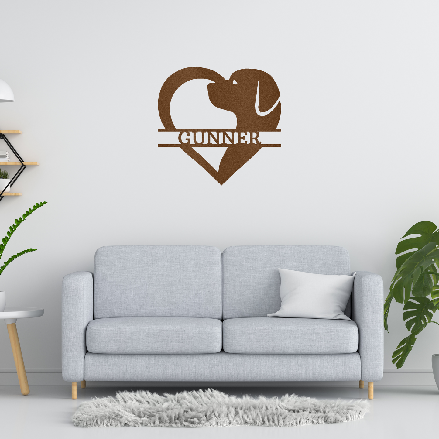 dog silhouette heart with personalized name metal wall decor with copper powder coat finish hanging on a white wall above a sofa