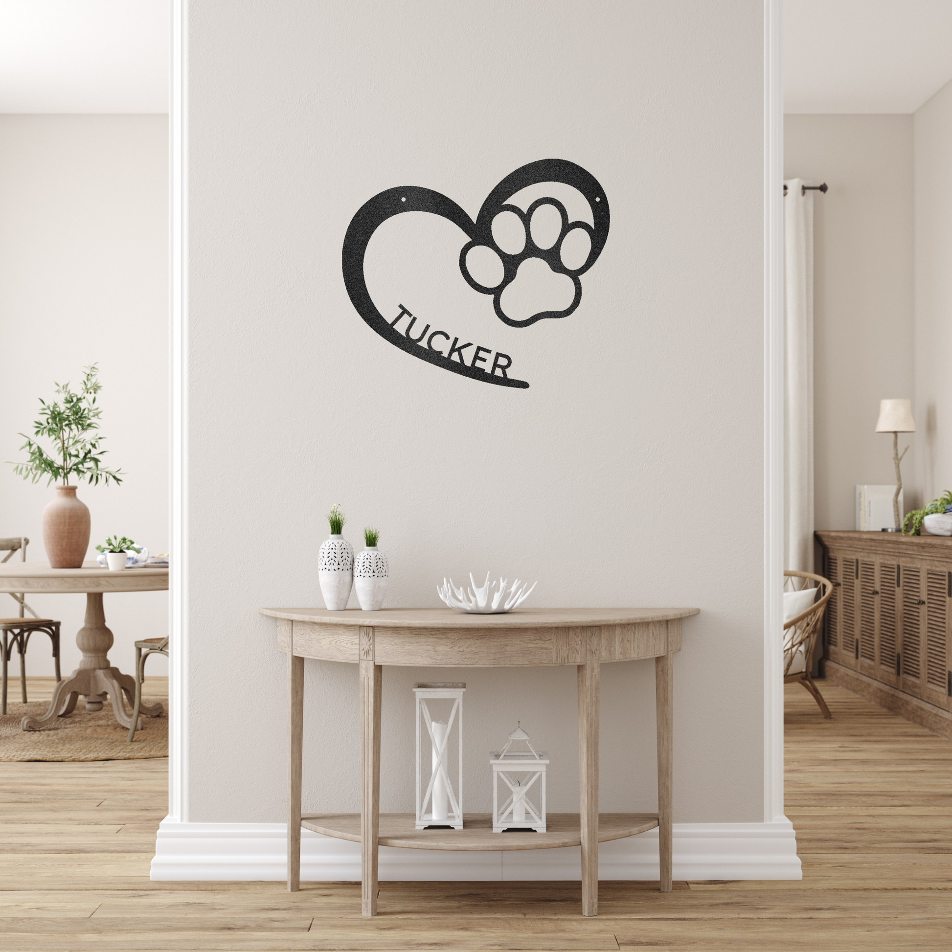 an open heart with a paw print in it, and personalized with a name, powder coat black finish metal wall decor, hanging on a cream colored wall over a small table | Home Accent Studio