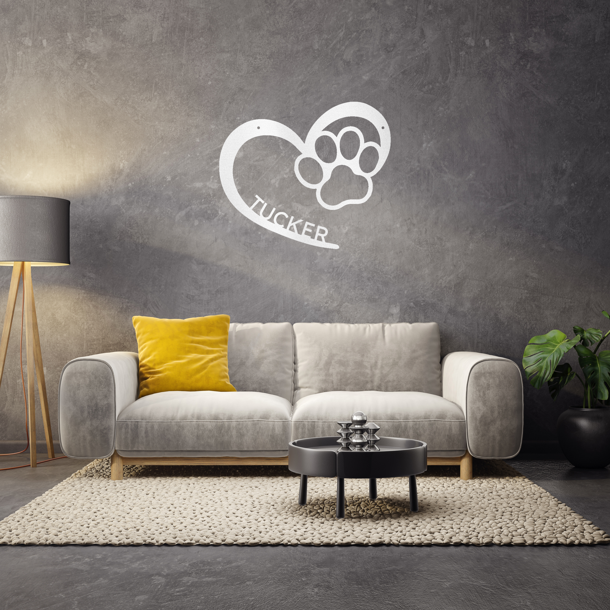 an open heart with a paw print in it, and personalized with a name, powder coat white finish metal wall decor, hanging on a charcoal grey accent wall over a grey sofa | Home Accent Studio